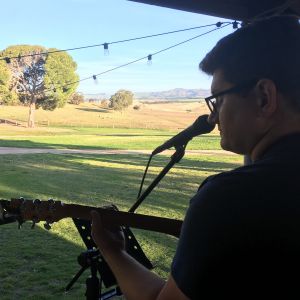 Marly Cruse playing guitar for wedding reception at Pindarie Wines Gomersal South Australia on 30th September 2018