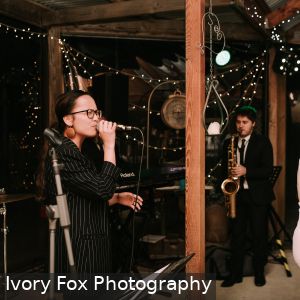 Yen Stender singing and Emile Ryjoch playing saxophone for wedding at White Hill Estate South Australia on 20th October 2018 as part of Cruse Entertainment