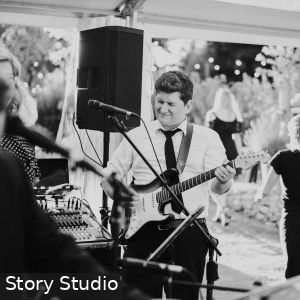 Marly Cruse playing guitar at a wedding in Hahndorf Adelaide South Australia as part of Cruse Entertainment