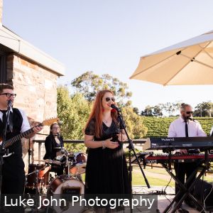Marly Cruse and Eliza Dickson and Natalie Cruse and Jonathan Ruse playing in the Cruse Entertainment band at a wedding in McLaren Vale South Australia